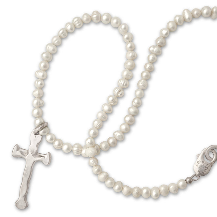 Pearl necklace with a cross pendant on a white background