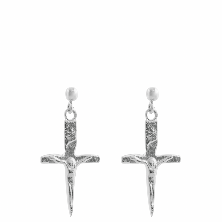 Pair of silver cross-shaped earrings on a white background