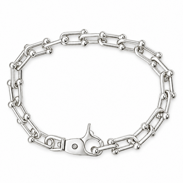 A silver-toned metal chain bracelet with a lobster clasp, displayed on a clean white background.