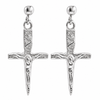 A pair of silver crucifix dangle earrings with textured hilts, detailed corpus figures, and round ball studs on a plain white background.