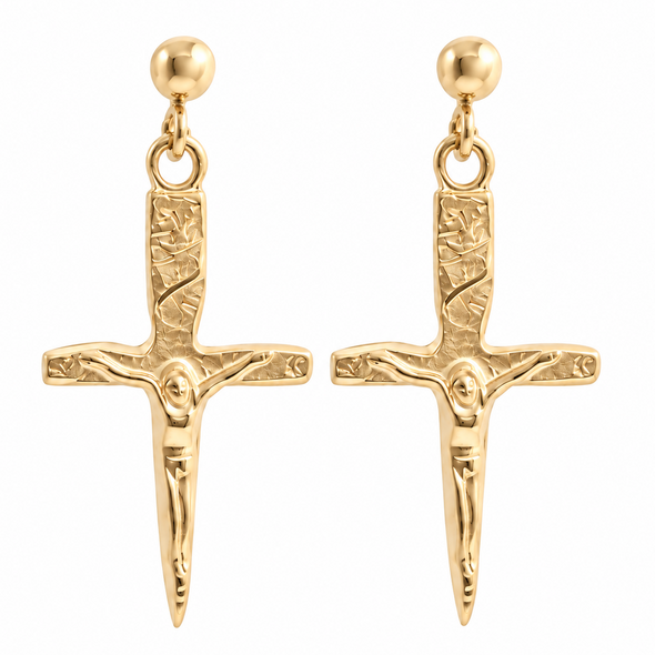 A pair of gold-tone drop earrings featuring a detailed crucifix pendant with a textured hilt, a figure of Jesus on the cross, and a round ball stud at the top, shown against a plain white background.