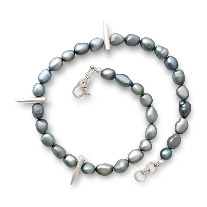 Gray pearl necklace with silver clasp on a white background