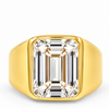 A yellow gold signet ring featuring a large rectangular emerald-cut clear gemstone, shown on a clean white background.