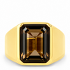 A yellow gold signet ring featuring a large, faceted rectangular emerald-cut brown gemstone, shown against a plain white background.