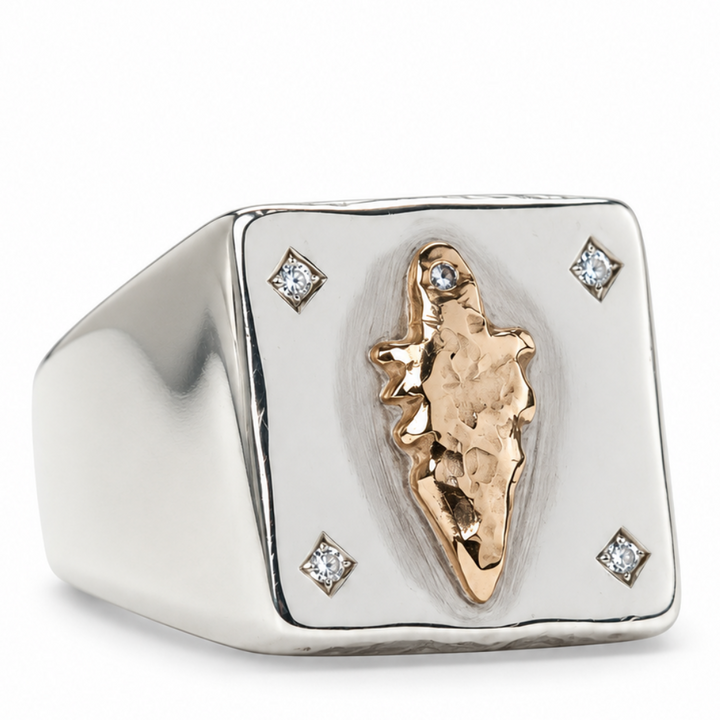 A square signet ring in polished silver with a textured rose gold central element and four small diamond accents, shown on a clean white background.