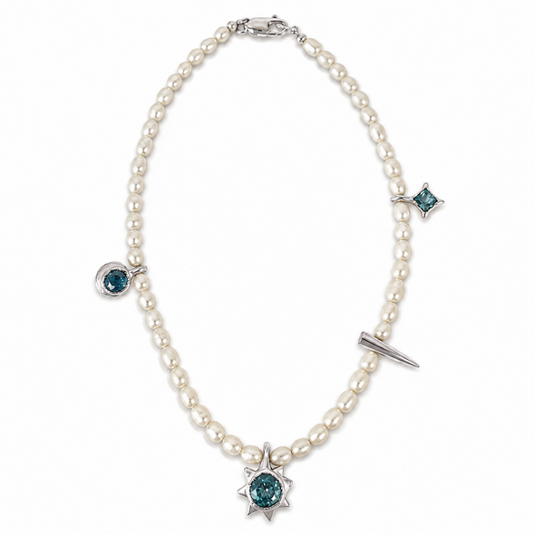 A pearl necklace with silver-toned metal settings and blue-green gemstone accents, including a prominent sunburst pendant at the center and smaller star and oval motifs at other points.