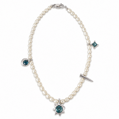 A pearl necklace with silver-toned metal settings and blue-green gemstone accents, including a prominent sunburst pendant at the center and smaller star and oval motifs at other points.