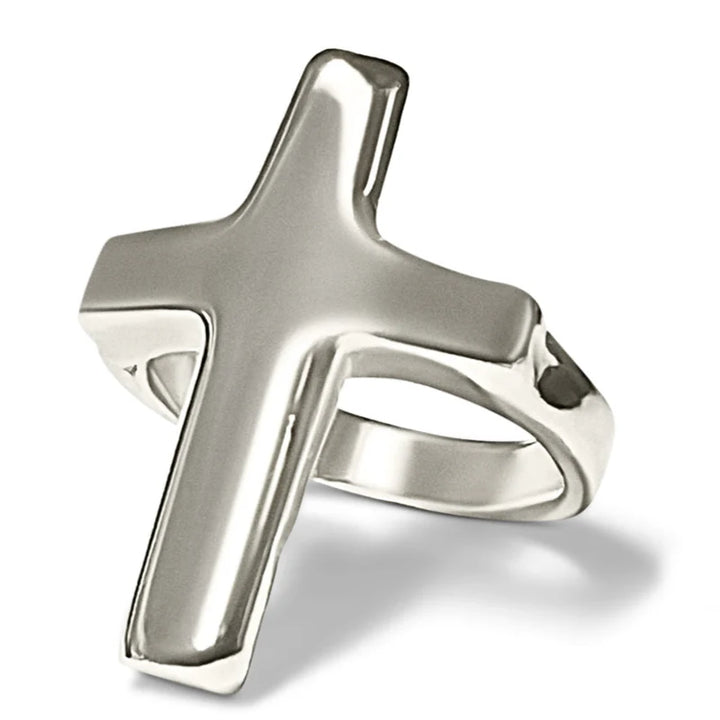 Silver cross-shaped ring on a white background