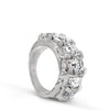 Silver ring with clear gemstones on a white background