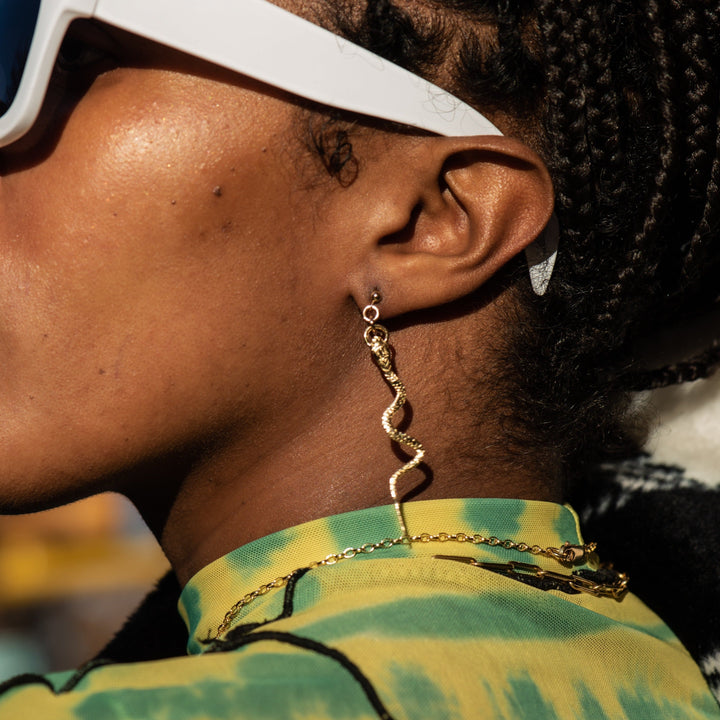 profile of female model wearing our Snake Stud