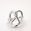 Silver pretzel ring on a white background