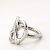 Silver Pretzel  ring with a unique design on a white background