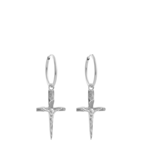 Silver cross earrings on a white background