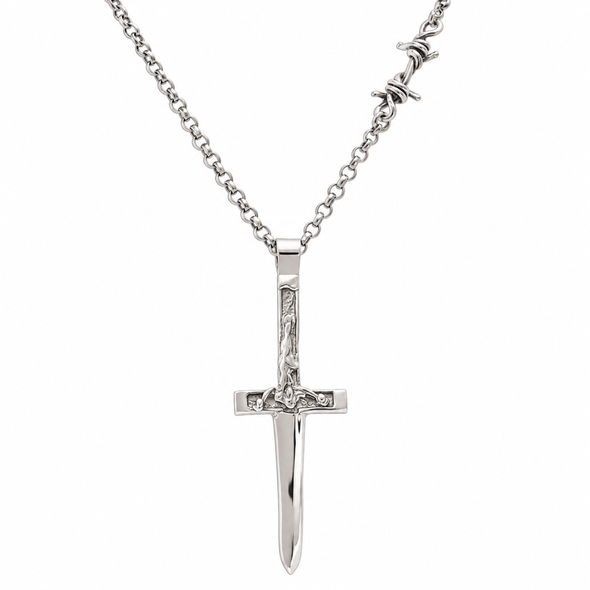 A silver crucifix pendant necklace on a matching silver chain, shown against a plain white background.