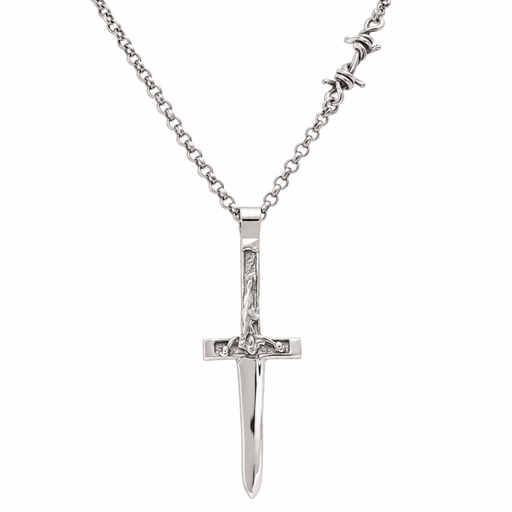 A silver crucifix pendant necklace on a matching silver chain, shown against a plain white background.