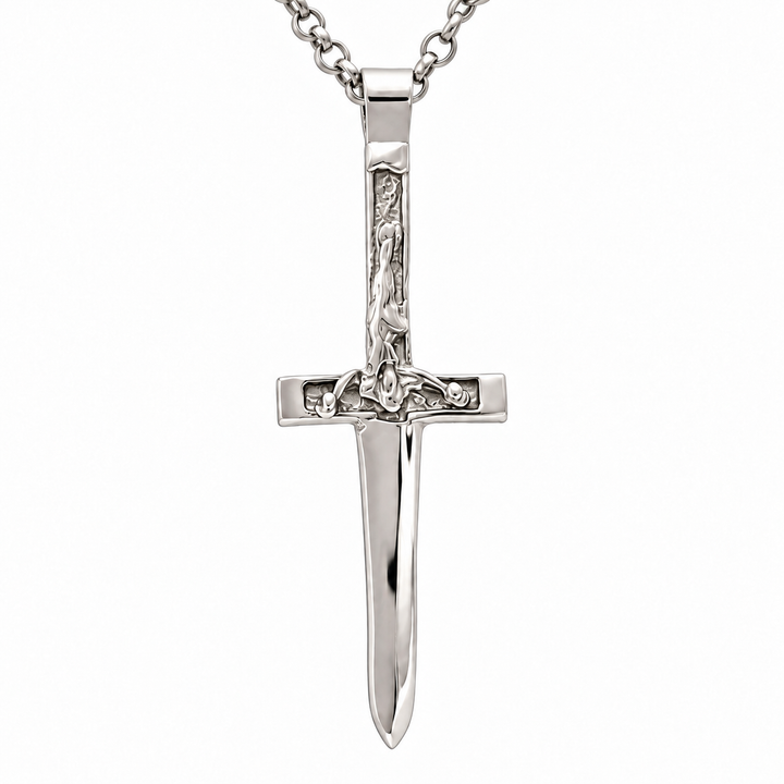 A polished silver sword pendant necklace featuring a detailed hilt with a sculpted figure, suspended from a matching silver link chain against a plain white background.