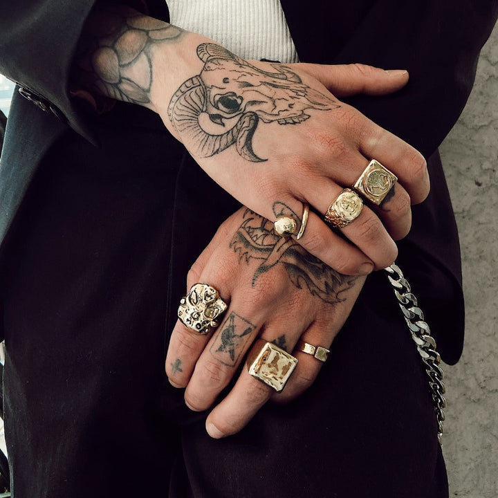 close up shot of hands wearing our square signet ring