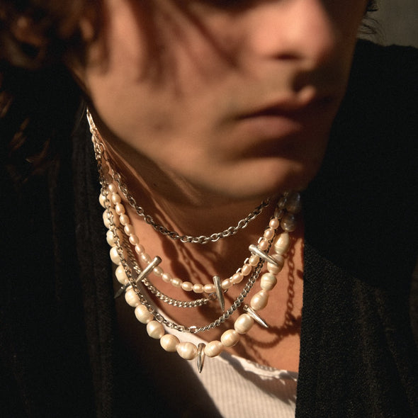 male model wearing our spike pearl necklace