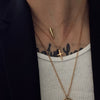 close up shot of neck with our gold spike necklace