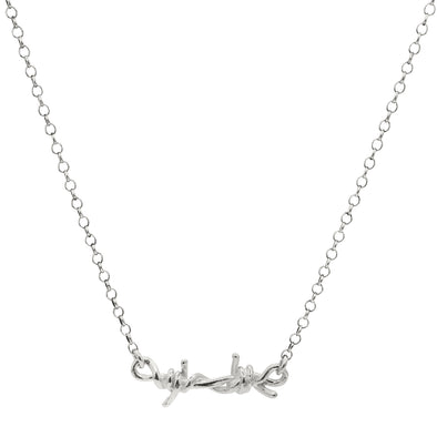 horizontal barbed wire sterling silver pendant hanging from silver rolo chain