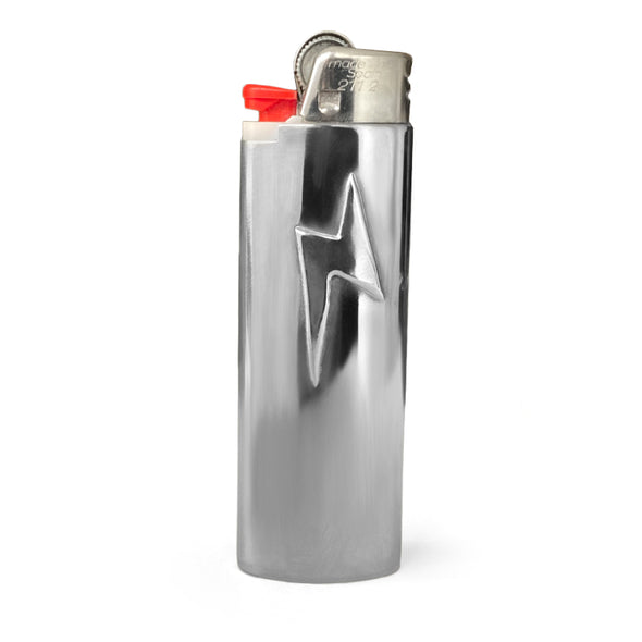 Silver lighter case with Lightning bolt detail in center.