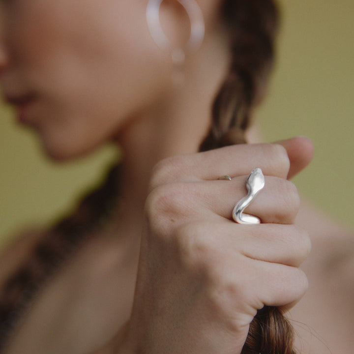 female model's fist wearing our open snake ring