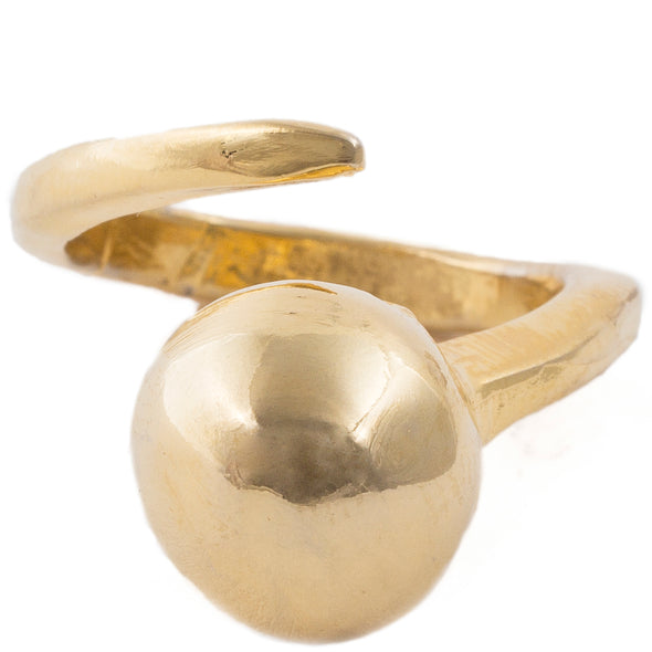 Handmade recycled Brass open loop ring with a bubble orb resting on top of the finger