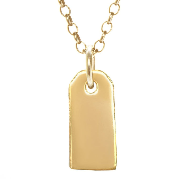 gold gravestone pendant hanging from gold rolo chain
