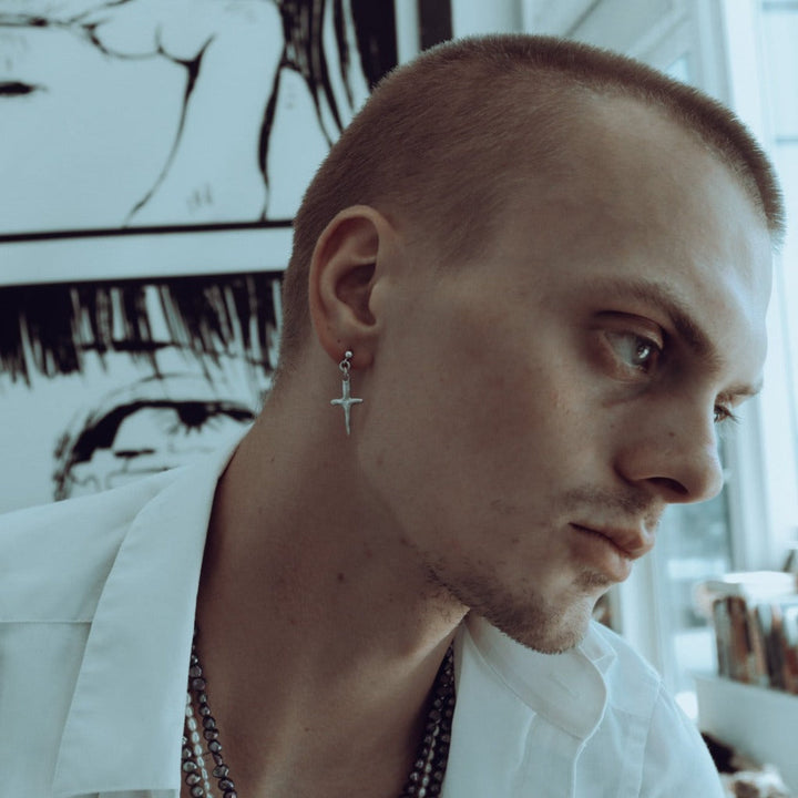 male model wearing our cross stud earring