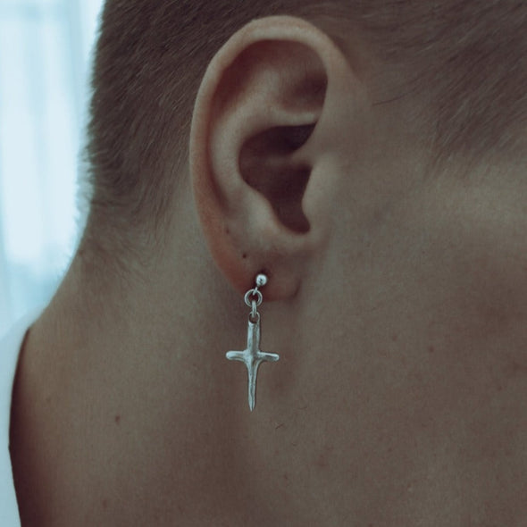 male model wearing our cross stud earring