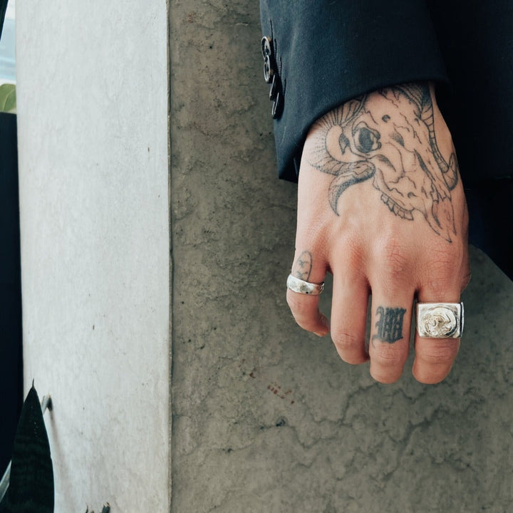 close up shot of hand wearing our silver melty band