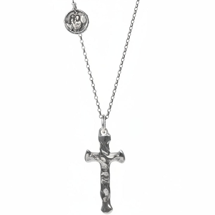 Handmade Sterling Silver Cross pendant hanging from a hypoallergenic Sterling Silver Argentium chain detailed with a with a Sterling Silver Coin