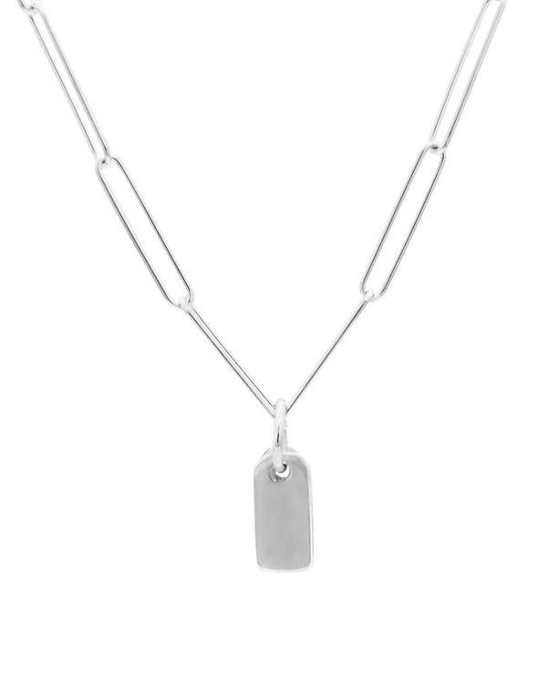 silver gravestone pendant hanging from silver paperclip chain