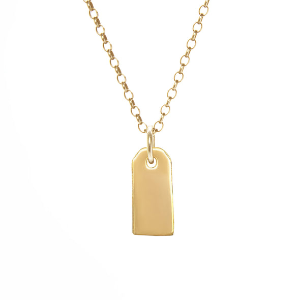 gold gravestone pendant hanging from gold rolo chain