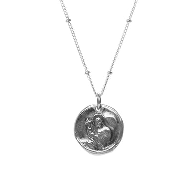 Handmade Sterling Silver Holy Coin hanging from a hypoallergenic Sterling Silver Argentium chain. The Holy Coin displays a guardian angel on one side and a saint on the other.