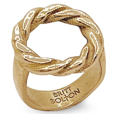 gold ring with a twisted hoop, shot on white background