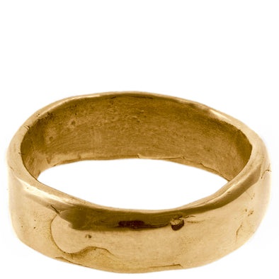 Melty Band Ring in Solid 14k yellow gold with a shiny melted looking surface standing in white background