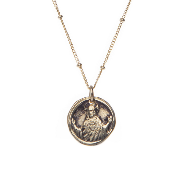 Handmade 14k Gold Plated Holy Coin hanging from a hypoallergenic 14k Gold Filled chain. The Holy Coin displays a guardian angel on one side and a saint on the other.