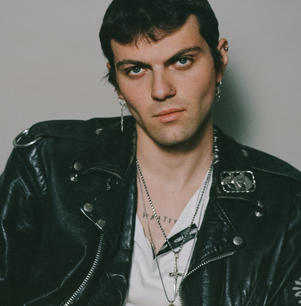 male model wearing leather biker jacket and our xl crucifix dagger necklace