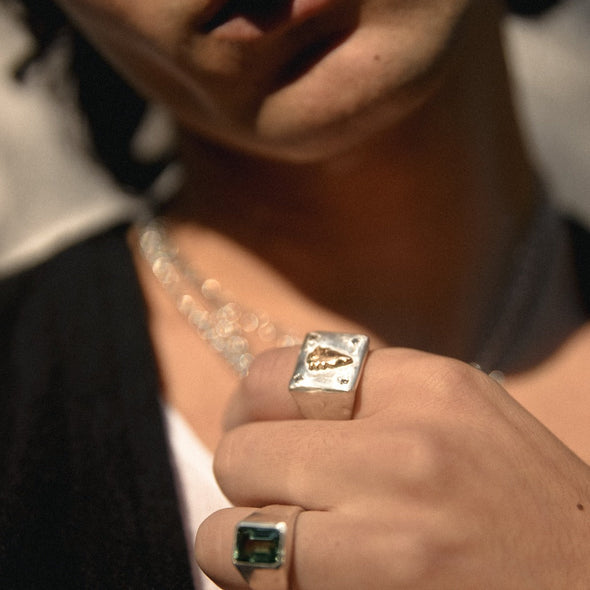 model wearing our 14k playing card signet