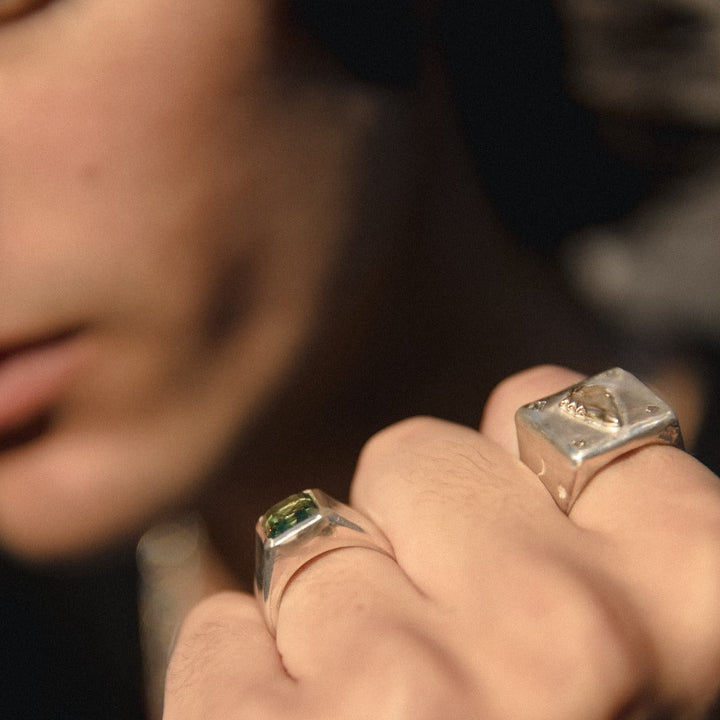 model wearing our 14k playing card signet