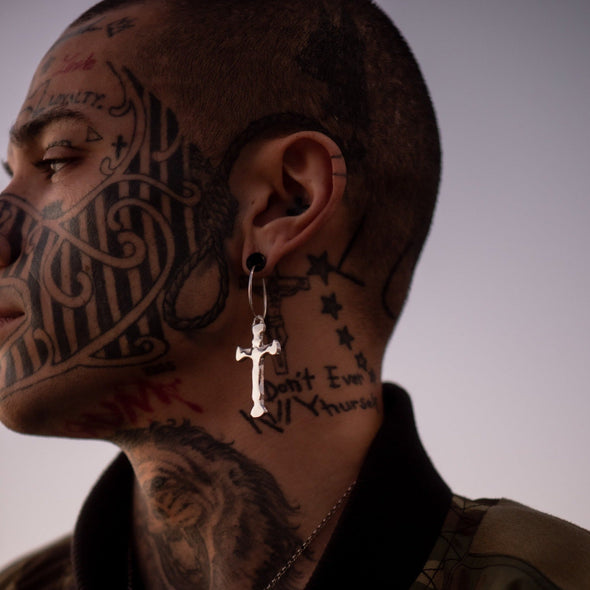 male model's profile, wearing our xl cross hoop
