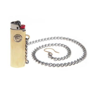 Lighter sleeve made from Brass sheet, with abstract virgin mary coin soldered onto it with pocket chain