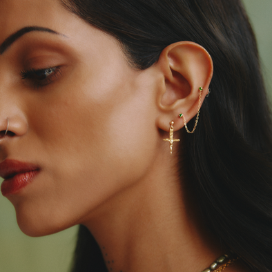 female model wearing our crucifix dagger stud