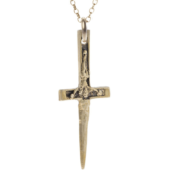 hammered brass xl crucifix dagger pendant hanging from 14k gold filled rolo chain