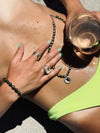 female model in summer setting wearing our spiral ring