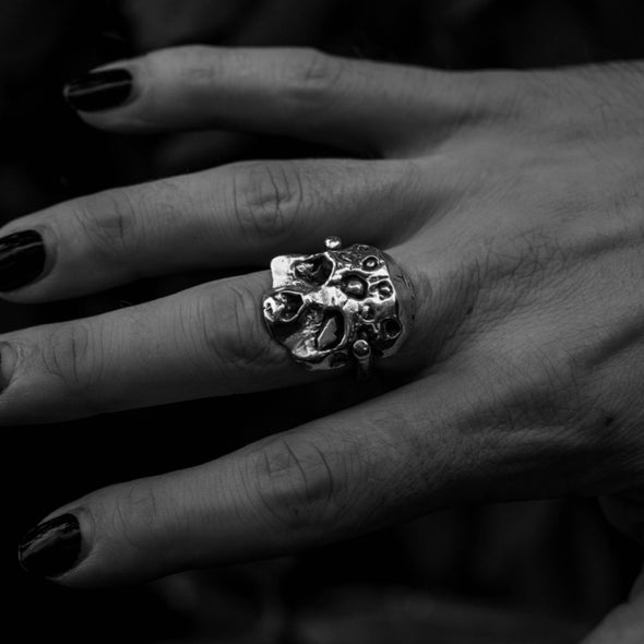 close up of hand wearing our zombie ring in silver