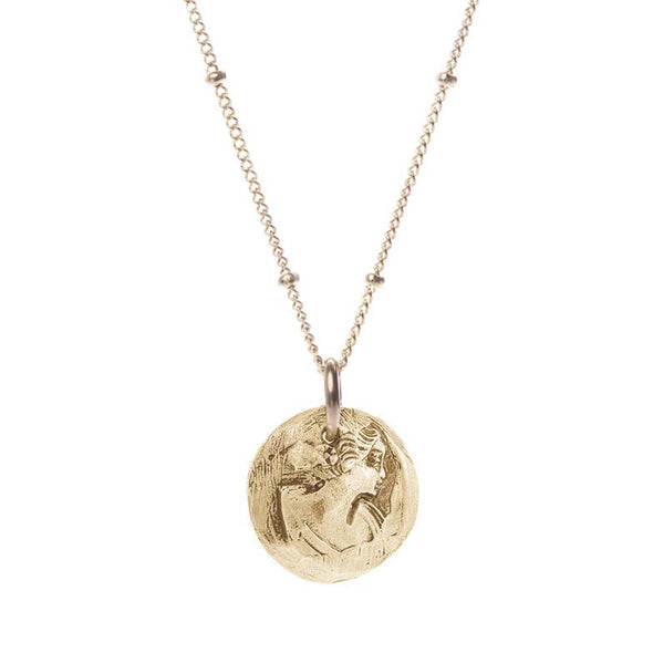 Coin necklace displaying a hand carved Maiden in 14k Gold plated-Brass. hanging from 14k gold filled hypoallergenic chain