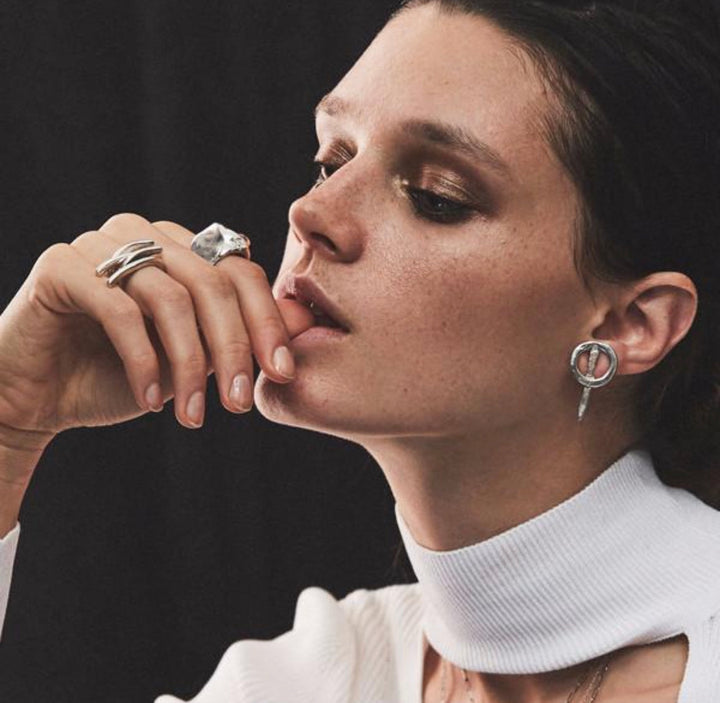 female model wearing our cosmic swoosh ring