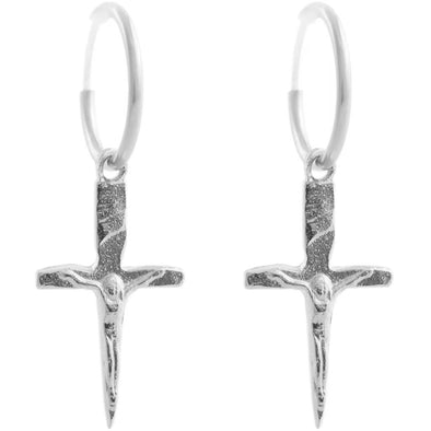 handmade crucifix shaped pendants in sterling silver hanging from a silver hoop